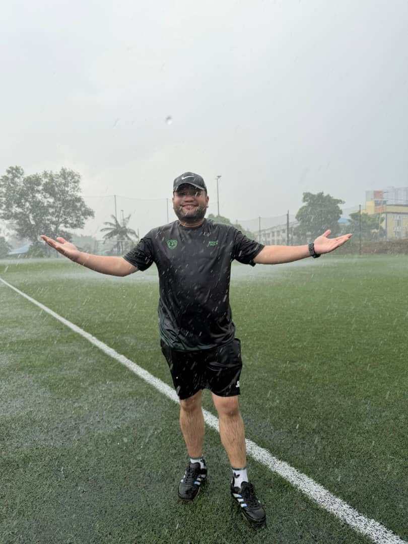 KroniBola admin in the rain
